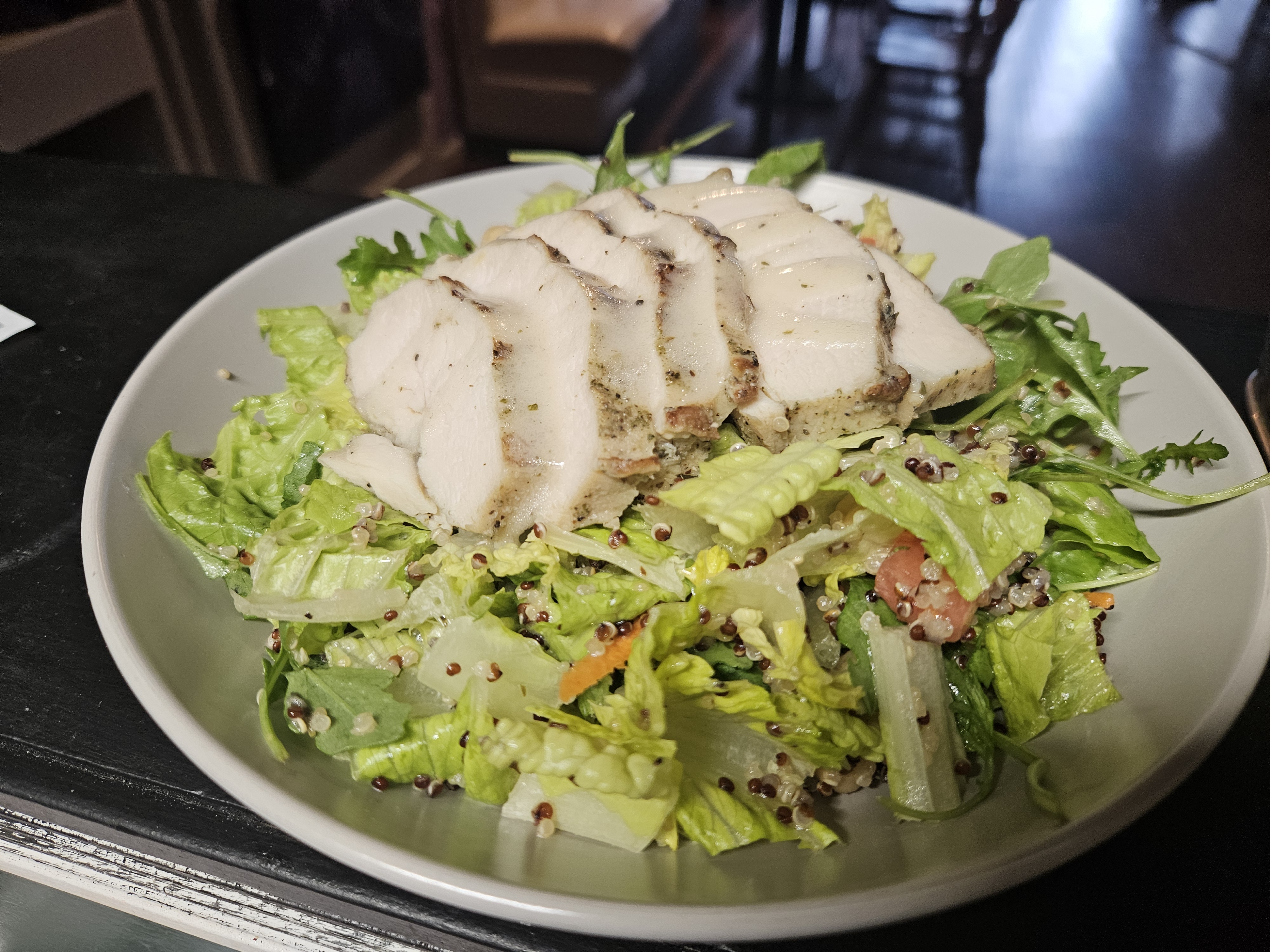 Fresh salad at Nerdateria — grilled chicken over greens
