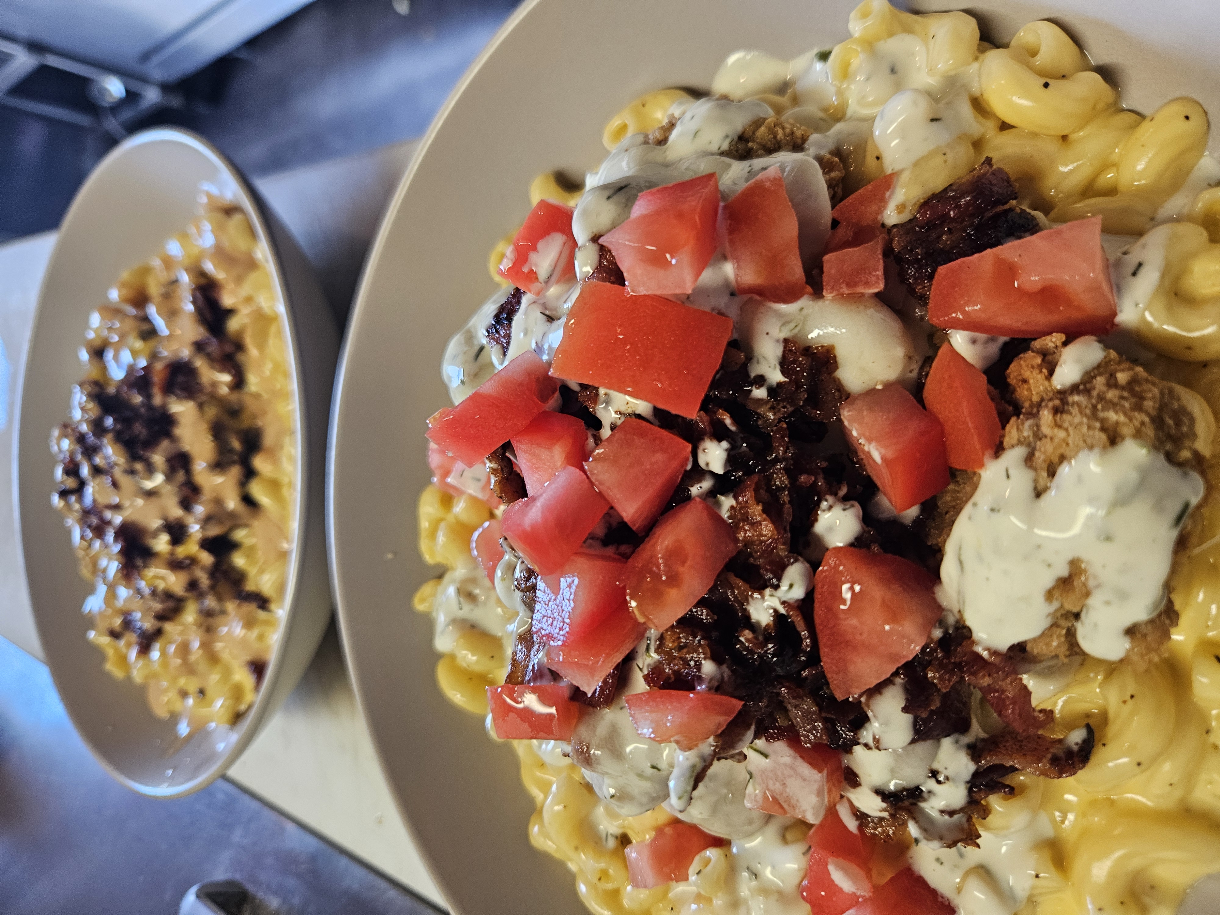 Loaded Bowl at Nerdateria — mac and cheese with brisket and tomatoes