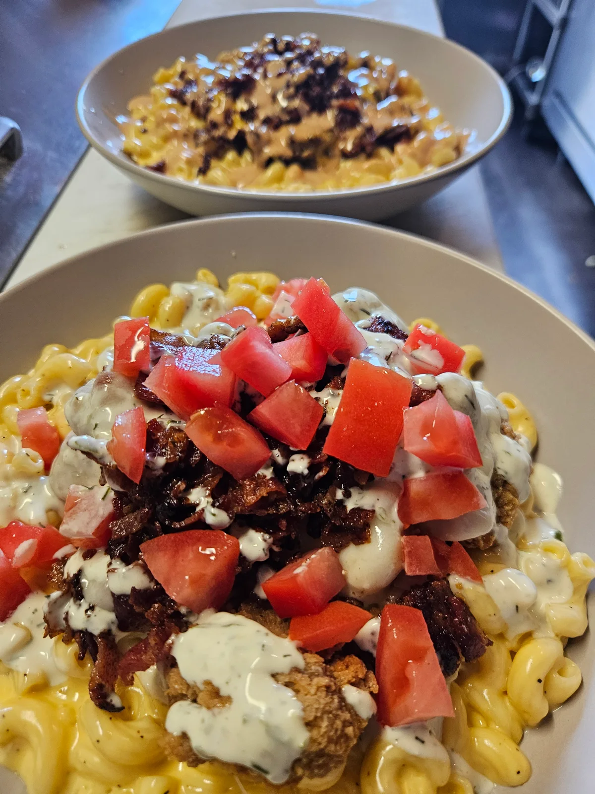 Loaded Bowl at Nerdateria — mac and cheese with brisket and tomatoes