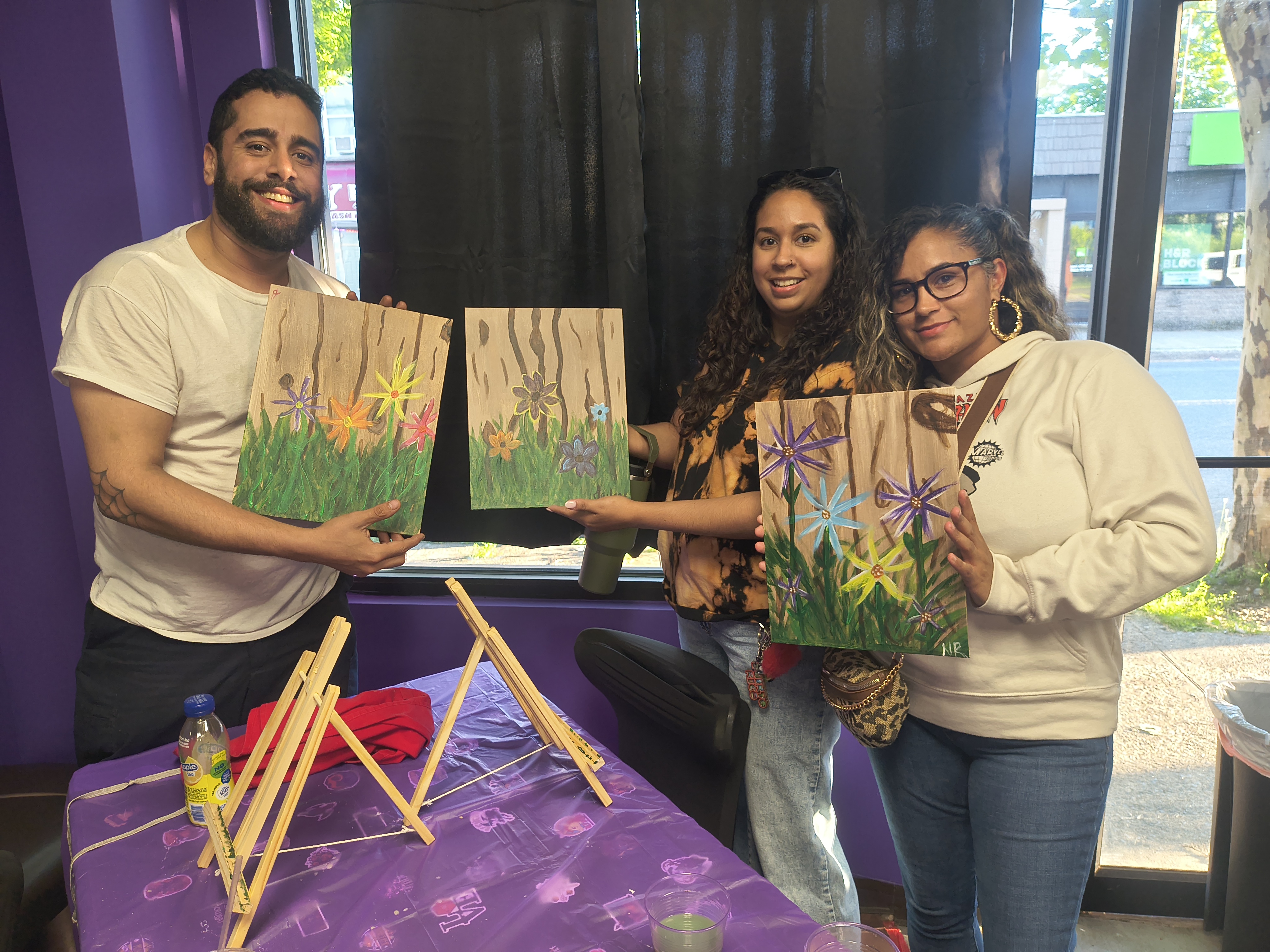 Guests showing finished paintings at Nerdateria