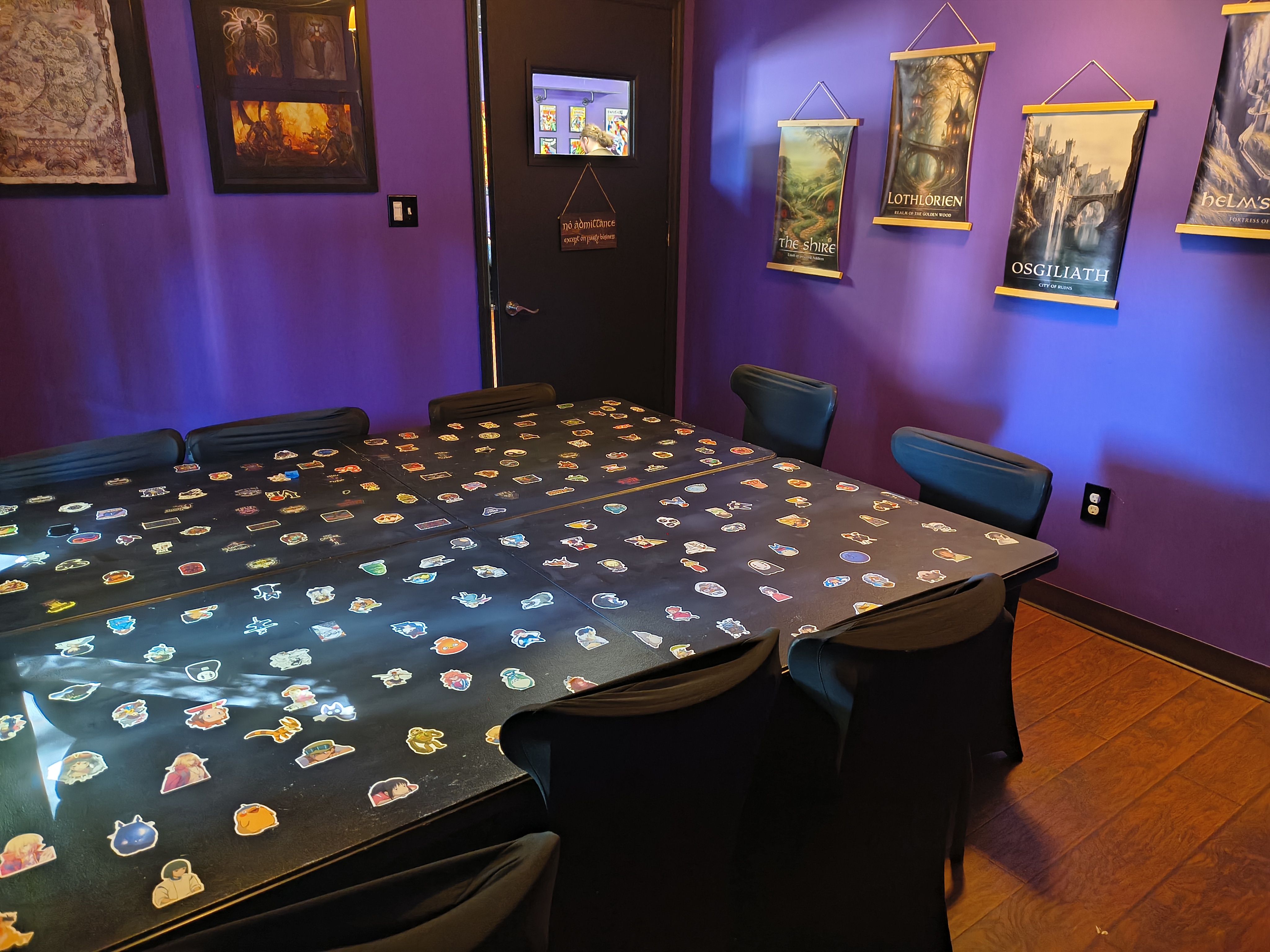 Private room at Nerdateria — sticker table and LOTR decor